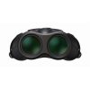 Black virtual reality headset with two green-tinted lenses facing forward, resting on a white background.