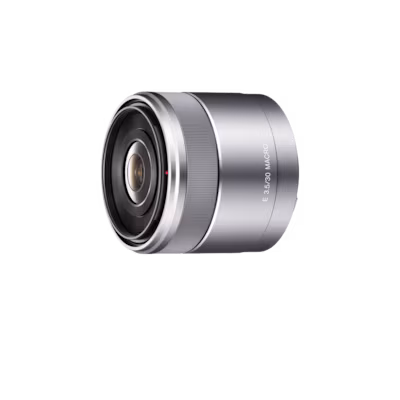 Silver camera lens shown from a front-right angle, displaying the glass element and metallic body.