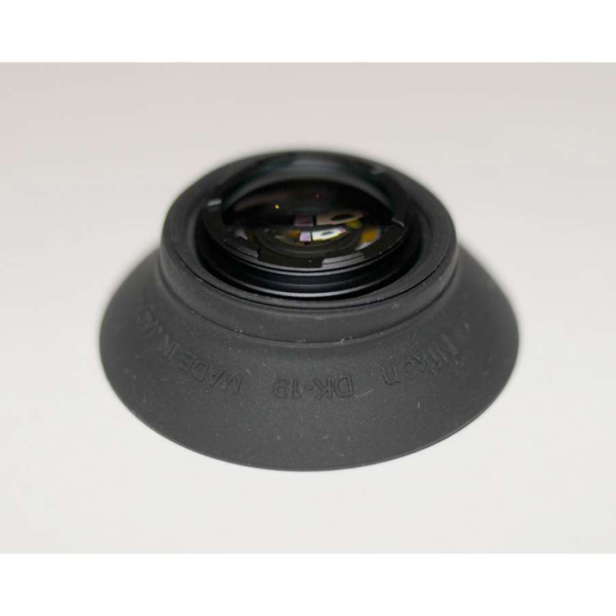 dsc1588jp8-900x900-1jpg | Kounio.gr Close-up of a camera lens with its front element exposed on a soft gray background.