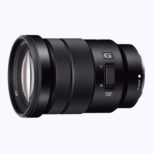 Close-up of a black camera lens with multiple zoom rings and a power zoom switch, viewed from the side.