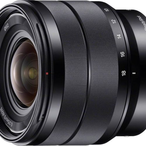 Close-up of a black camera zoom lens with knurled rings and visible focal length markings on the side.