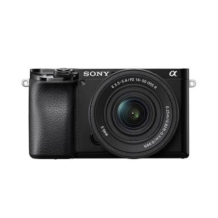Front view of a Sony α mirrorless camera with a 16-50mm zoom lens attached