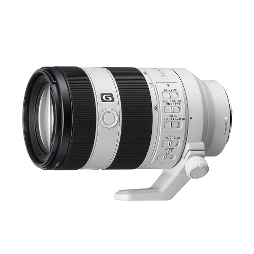 White telephoto camera lens with a black zoom ring and attached tripod foot, facing left.